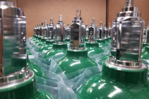 oxygen supplier cylinders green medical oxygen tanks with post valves ready for oxygen delivery and refill service